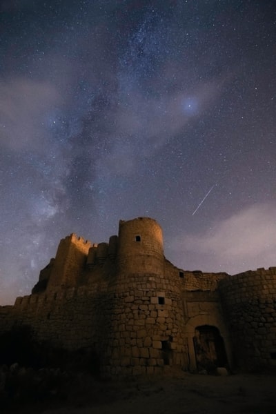 brown concrete building under starry night